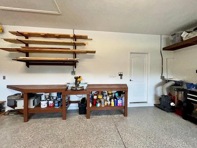 5839 Tarleton Way, Mount Dora, FL 32757 - interior space with a workshop area and speckle patterned floor