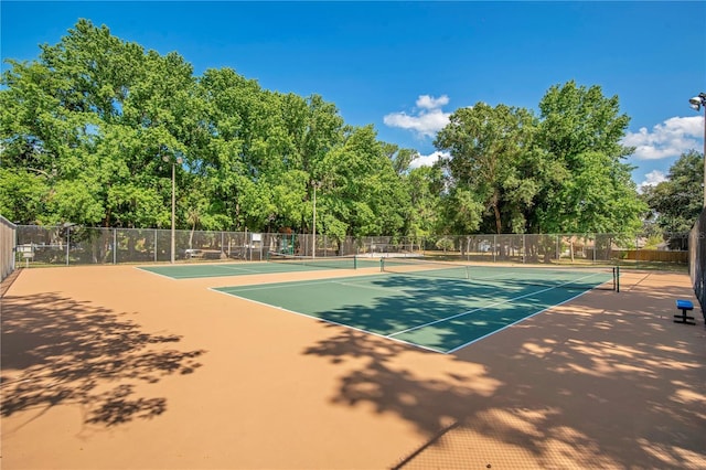view of sport court with community basketball court and fence