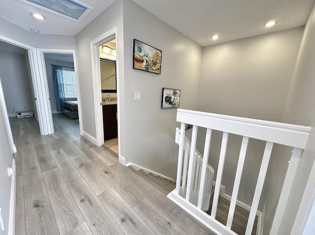 2904 Cayenne Ave, Pembroke Pines, FL 33026 - corridor featuring baseboards, recessed lighting, an upstairs landing, and light wood finished floors