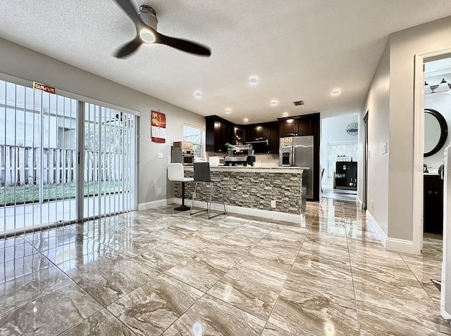2904 Cayenne Ave, Pembroke Pines, FL 33026 - living area with ceiling fan, visible vents, marble finish floor, and baseboards