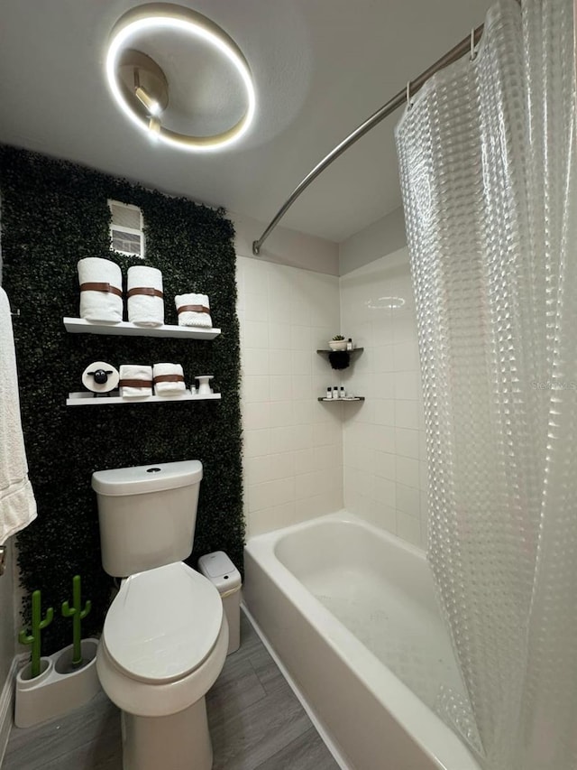 6403 Parc Corniche Dr Unit 4308, Orlando, FL 32821 - bathroom with toilet, wood finished floors, and shower / bath combo