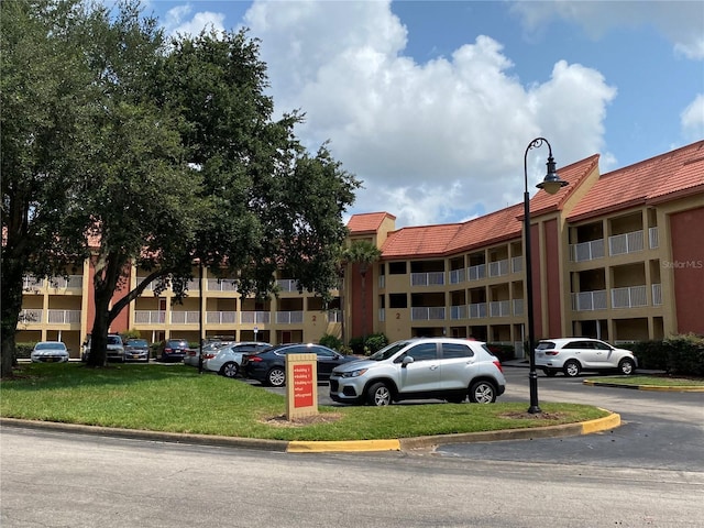 6403 Parc Corniche Dr Unit 4308, Orlando, FL 32821 - view of building exterior with uncovered parking