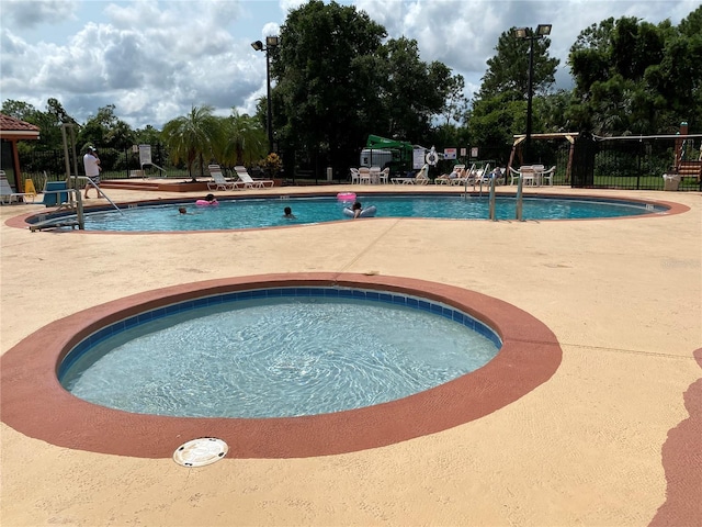 6403 Parc Corniche Dr Unit 4308, Orlando, FL 32821 - community pool with fence and a patio area