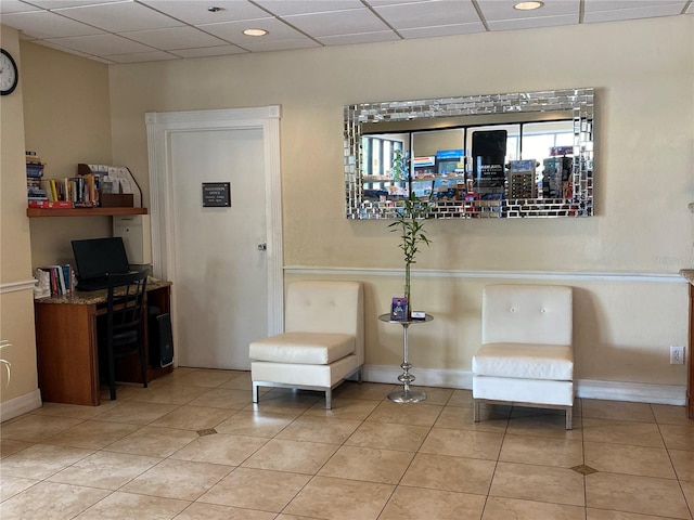6403 Parc Corniche Dr Unit 4308, Orlando, FL 32821 - living area featuring baseboards, a drop ceiling, and light tile patterned floors