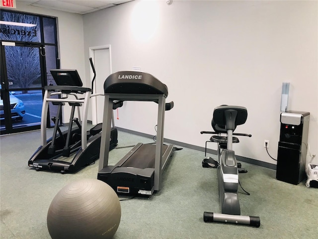 6403 Parc Corniche Dr Unit 4308, Orlando, FL 32821 - gym with baseboards and a paneled ceiling