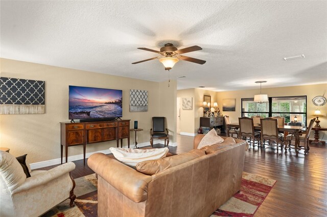 195 E Faith Ter, Maitland, FL 32751 - living room featuring baseboards, a ceiling fan, a textured ceiling, and wood finished floors