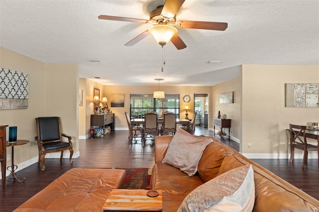 195 E Faith Ter, Maitland, FL 32751 - living area with a textured ceiling, baseboards, and wood finished floors