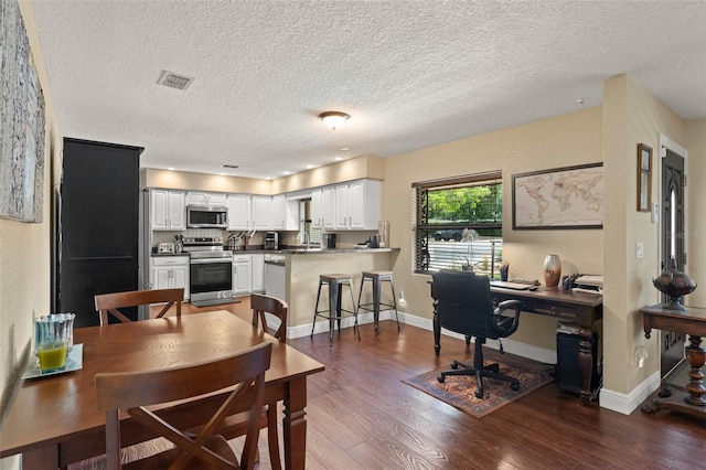 195 E Faith Ter, Maitland, FL 32751 - dining space with baseboards, a textured ceiling, visible vents, and dark wood finished floors