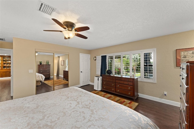 195 E Faith Ter, Maitland, FL 32751 - bedroom with baseboards, ceiling fan, dark wood finished floors, and visible vents