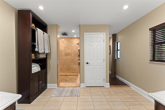 195 E Faith Ter, Maitland, FL 32751 - full bath with a walk in shower, tile patterned flooring, vanity, recessed lighting, and baseboards