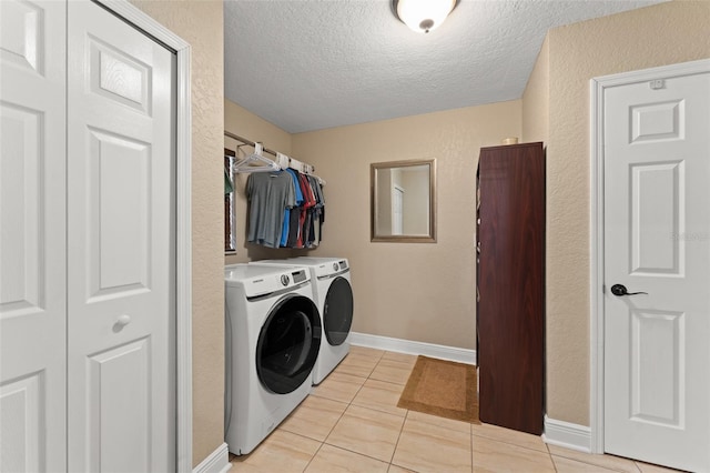 195 E Faith Ter, Maitland, FL 32751 - clothes washing area with laundry area, a textured ceiling, light tile patterned floors, baseboards, and separate washer and dryer