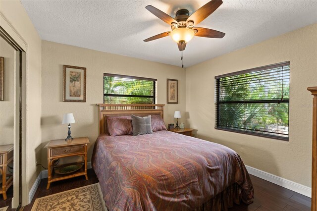 195 E Faith Ter, Maitland, FL 32751 - bedroom with baseboards, a textured ceiling, ceiling fan, and wood finished floors