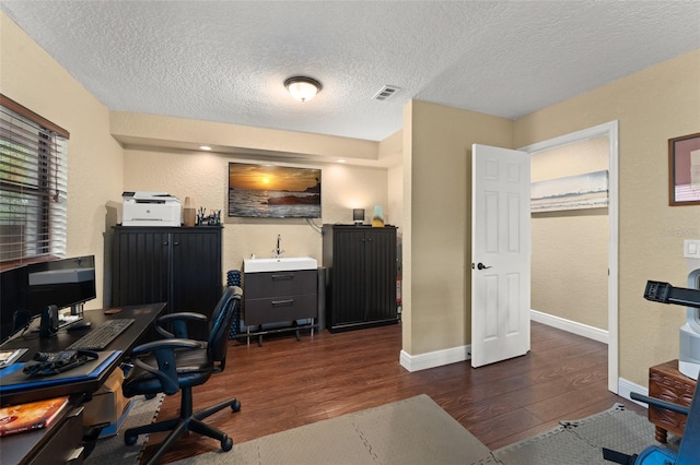 195 E Faith Ter, Maitland, FL 32751 - office space featuring baseboards, a textured wall, dark wood-style flooring, and a textured ceiling