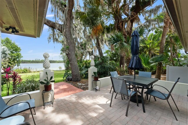 195 E Faith Ter, Maitland, FL 32751 - view of patio featuring a water view and outdoor dining space