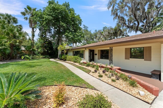 195 E Faith Ter, Maitland, FL 32751 - view of front facade featuring fence and a front lawn