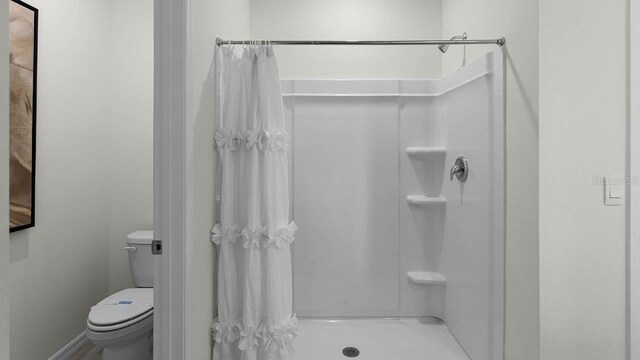 33620 Seattle Slew Dr, Sorrento, FL 32776 - full bathroom featuring toilet and a shower stall