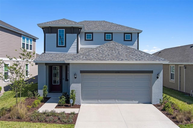 traditional-style house with concrete driveway, an attached garage, a shingled roof, and stucco siding