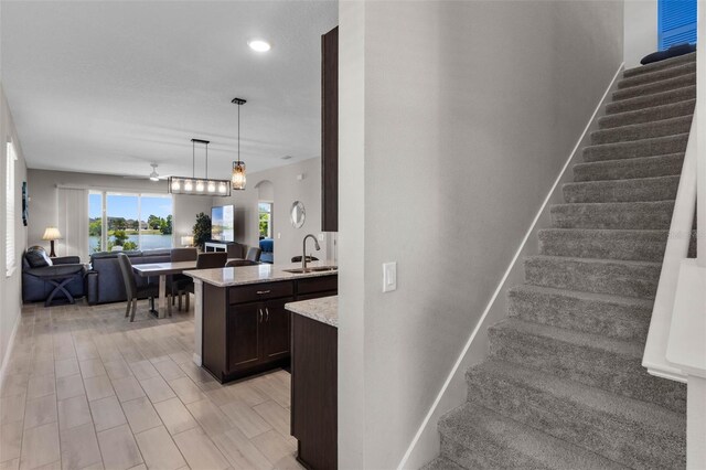 stairs featuring recessed lighting