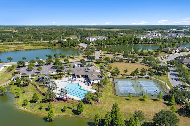 birds eye view of property with a water view