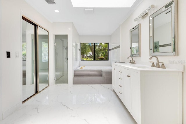 2108 Silver Leaf Ct, Longwood, FL 32779 - bathroom with double vanity, marble finish floor, a bath, a sink, and a stall shower