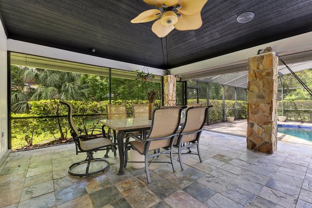 2108 Silver Leaf Ct, Longwood, FL 32779 - view of patio featuring a lanai, a ceiling fan, outdoor dining area, and an outdoor pool