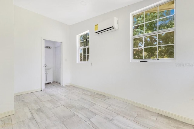 2108 Silver Leaf Ct, Longwood, FL 32779 - spare room featuring an AC wall unit and baseboards