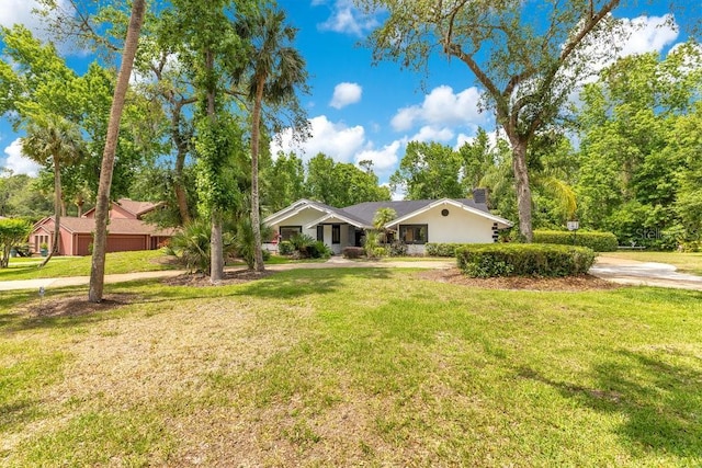 2108 Silver Leaf Ct, Longwood, FL 32779 - view of front of property with a chimney, an attached garage, driveway, and a front yard