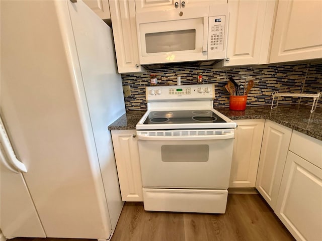 kitchen featuring wood finished floors, white appliances, and white cabinetry