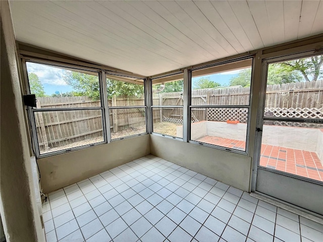 unfurnished sunroom with a healthy amount of sunlight