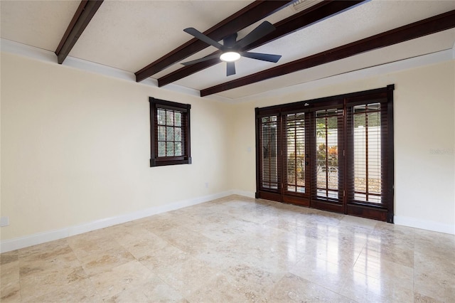 spare room with beam ceiling, ceiling fan, and plenty of natural light