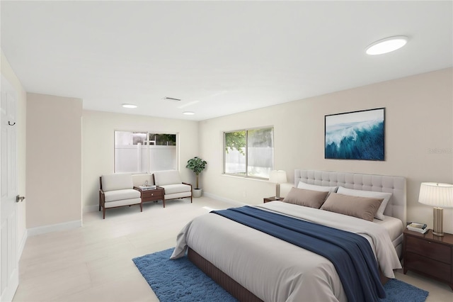 bedroom with baseboards and visible vents