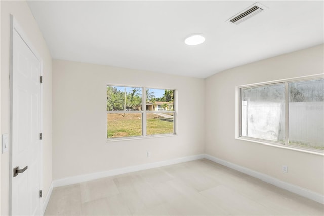 unfurnished bedroom featuring visible vents and baseboards