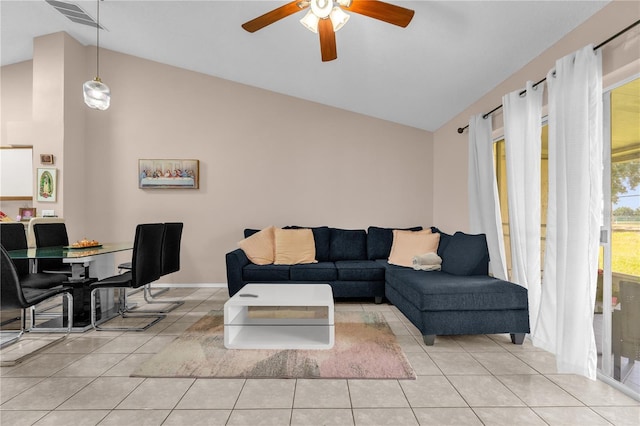 living room featuring ceiling fan, visible vents, light tile patterned floors, and high vaulted ceiling