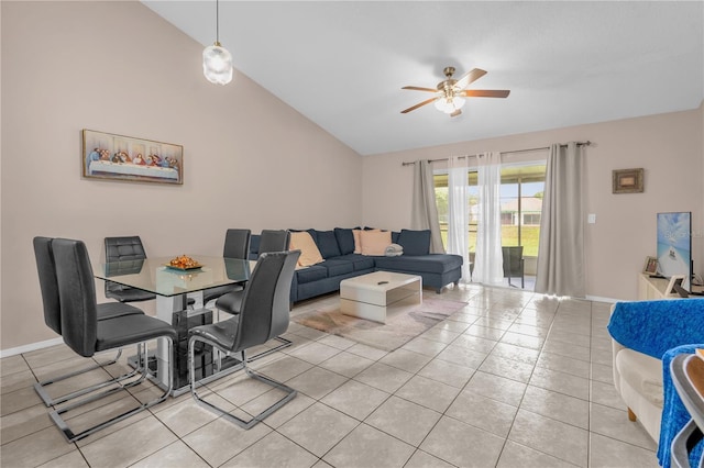 living room with light tile patterned floors, baseboards, a ceiling fan, and lofted ceiling