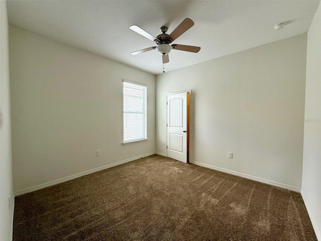 274 Brunswick Dr, Davenport, FL 33837 - unfurnished room featuring dark carpet, a ceiling fan, and baseboards