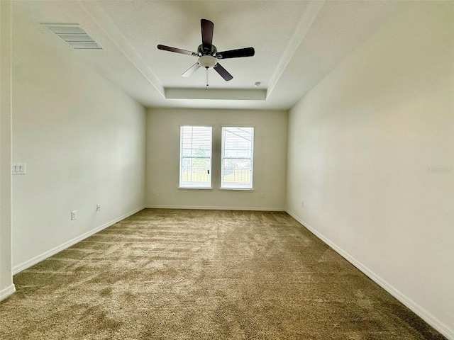 274 Brunswick Dr, Davenport, FL 33837 - carpeted empty room with a raised ceiling, a ceiling fan, and baseboards