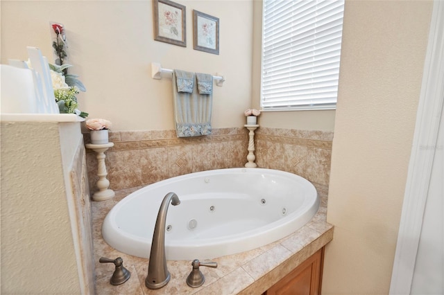 full bathroom featuring a jetted tub