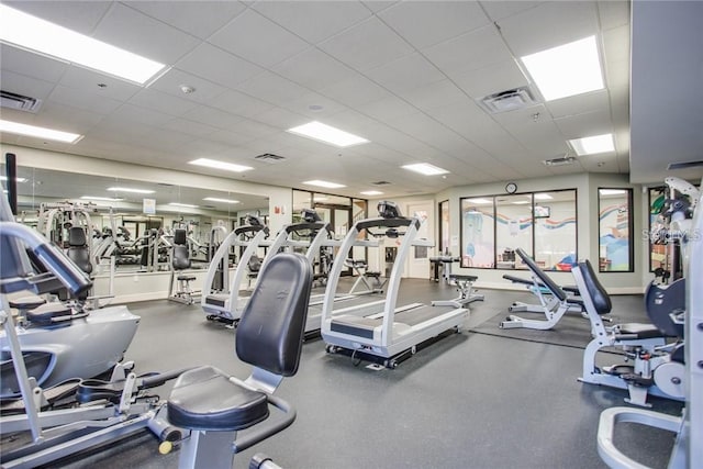 exercise room featuring a drop ceiling and visible vents