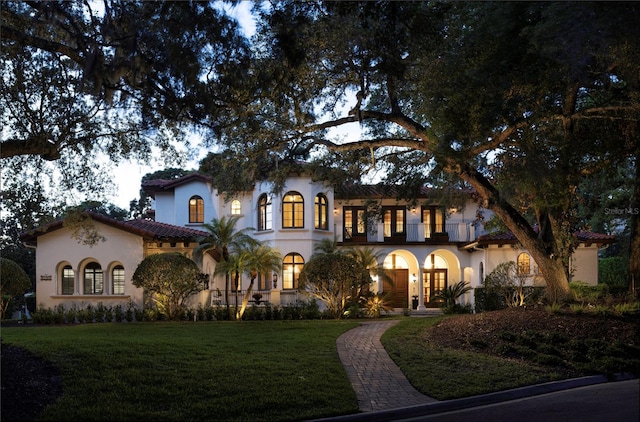 1716 Greystone Ct, Longwood, FL 32779 - mediterranean / spanish home featuring french doors, stucco siding, and a front lawn