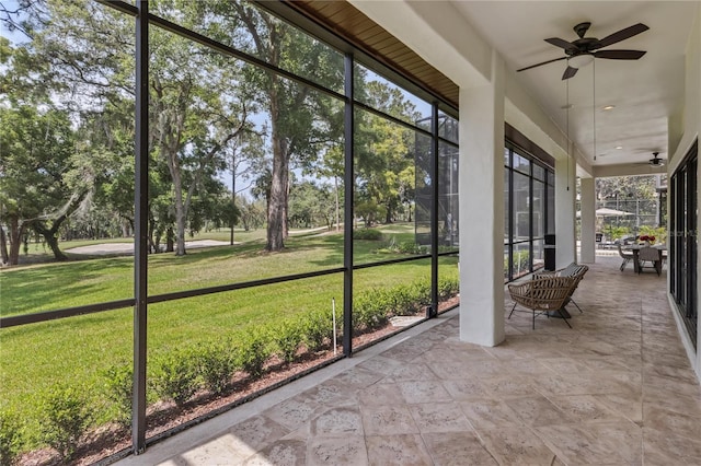 1716 Greystone Ct, Longwood, FL 32779 - unfurnished sunroom featuring ceiling fan