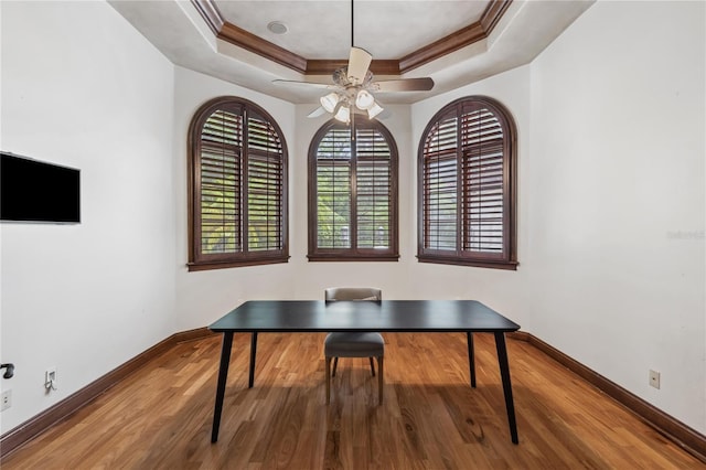 1716 Greystone Ct, Longwood, FL 32779 - home office featuring crown molding, wood finished floors, baseboards, a raised ceiling, and a ceiling fan
