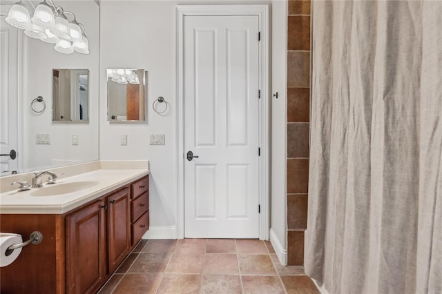 1716 Greystone Ct, Longwood, FL 32779 - full bath with vanity, baseboards, a tile shower, and a chandelier