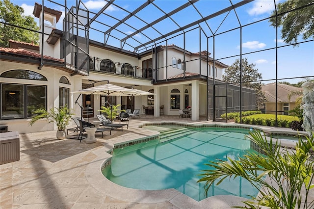 1716 Greystone Ct, Longwood, FL 32779 - rear view of house featuring a pool with connected hot tub, stucco siding, a patio area, a balcony, and a lanai