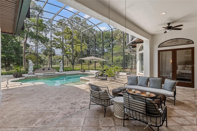 1716 Greystone Ct, Longwood, FL 32779 - view of swimming pool featuring ceiling fan, a lanai, a pool with connected hot tub, an outdoor hangout area, and a patio