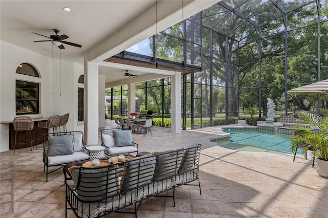 1716 Greystone Ct, Longwood, FL 32779 - view of patio / terrace with ceiling fan, a lanai, an outdoor hangout area, a pool with connected hot tub, and outdoor dining space