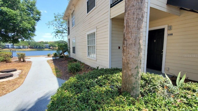 1071 S Hiawassee Rd Unit 1211, Orlando, FL 32835 - view of exterior entry featuring a water view