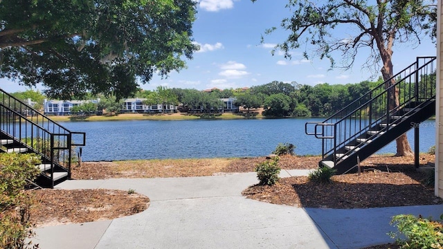 1071 S Hiawassee Rd Unit 1211, Orlando, FL 32835 - water view featuring stairs