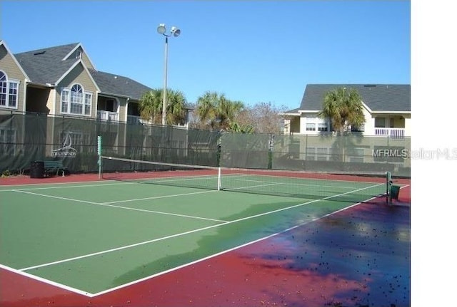 1071 S Hiawassee Rd Unit 1211, Orlando, FL 32835 - view of tennis court featuring community basketball court and fence
