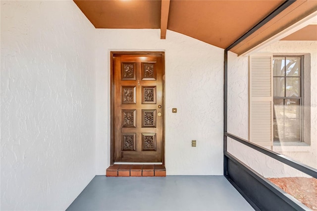 doorway to property with stucco siding