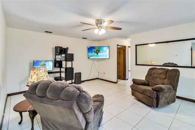 living room with a ceiling fan, baseboards, visible vents, and light tile patterned floors